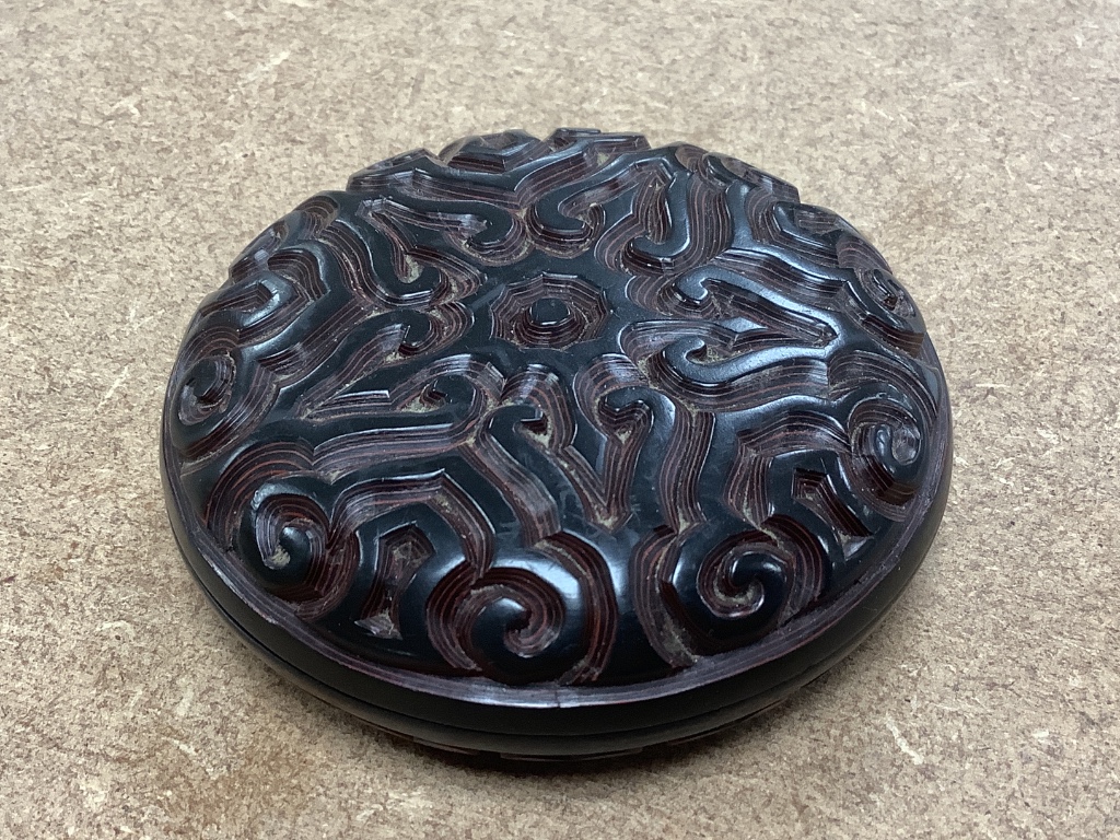 A Chinese 'tixi' lacquer circular box and cover, 8cm diameter